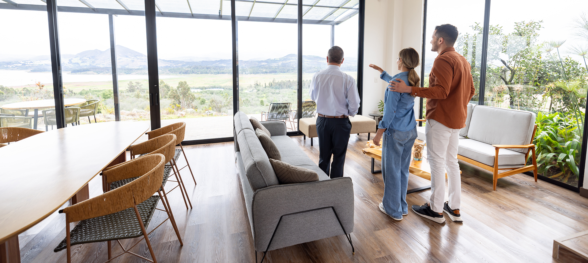 People admiring scenic view from living room