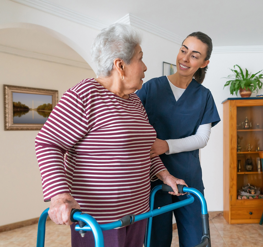 Elderly woman assisted by caregiver